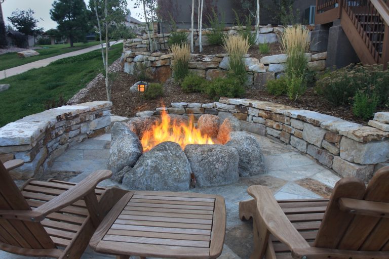This entire outdoor living area is built from natural stone. The natural gas boulder fire pit is sure to provide year round enjoyment.