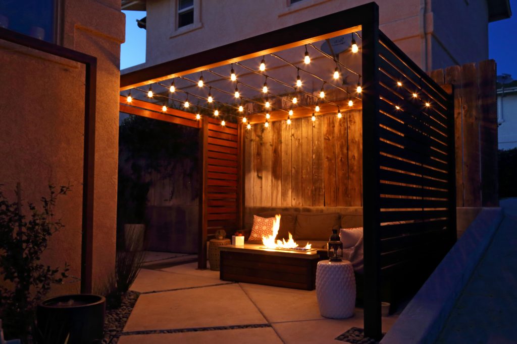 Inspiration for a small modern courtyard concrete patio remodel in San Luis Obispo with a fire pit and a pergola