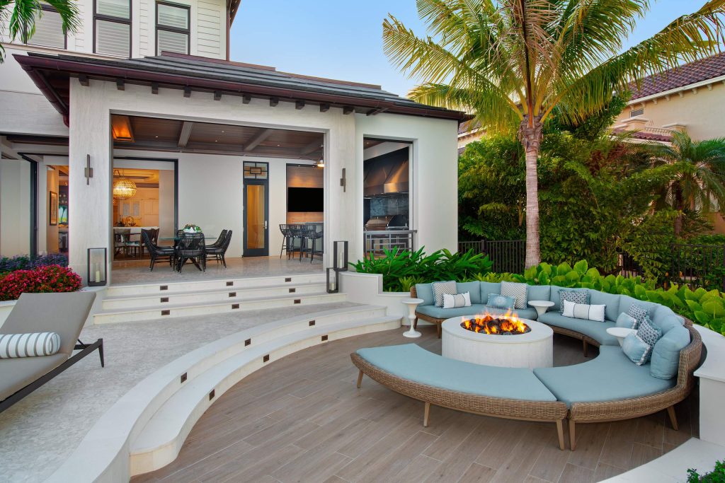 Tuscan backyard patio photo in Miami with a fire pit and no cover