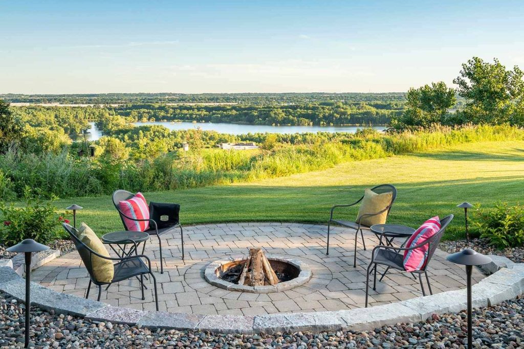Circular paver fire patio makes the most of this gorgeous Minnesota River vista.