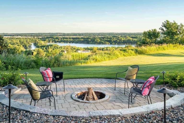 Circular paver fire patio makes the most of this gorgeous Minnesota River vista.