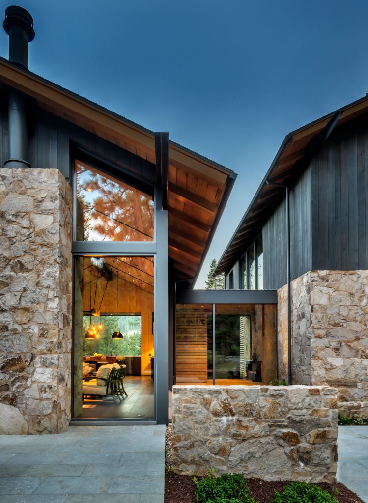 Patio - large rustic backyard stone patio idea in Sacramento with a fire pit and no cover