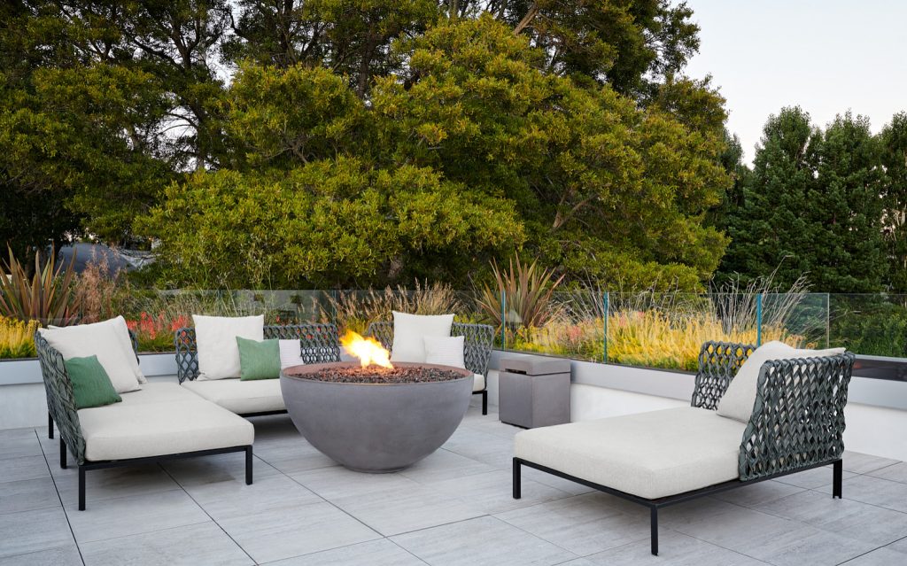 Trendy tile patio photo in San Francisco with a fire pit and no cover