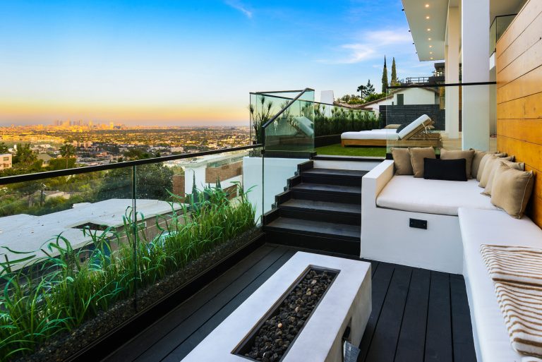 Trendy backyard deck photo in Los Angeles with a fire pit