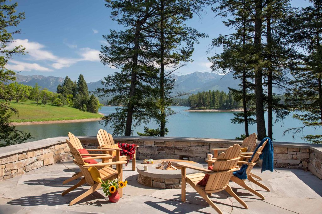 Inspiration for a rustic patio remodel in Other with a fire pit and no cover