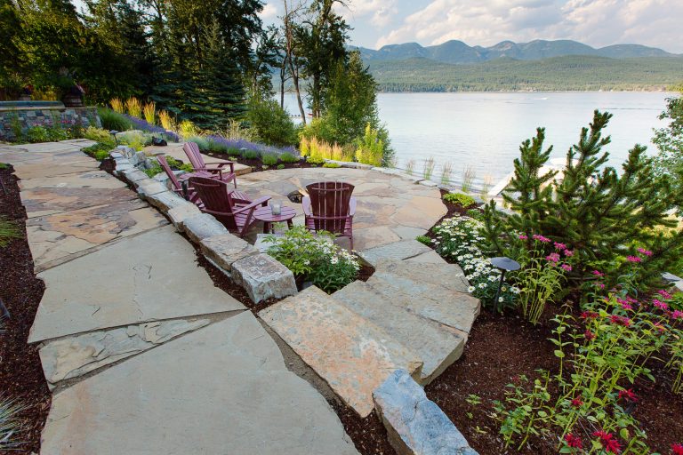 Chief cliff rock walls terrace the hillside creating livable patio spaces in a challenging, steep-sloped backyard.