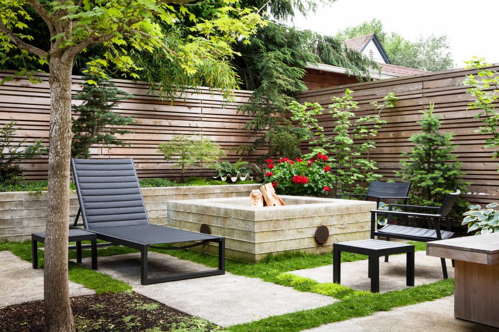 This project reimagines an under-used back yard in Portland, Oregon, creating an urban garden with an adjacent writer’s studio. Taking inspiration from Japanese precedents, we conceived of a paving scheme with planters, a cedar soaking tub, a fire pit, and a seven-foot-tall cedar fence. A maple tree forms the focal point and will grow to shade the yard. Photo: Anna M Campbell: annamcampbell.com