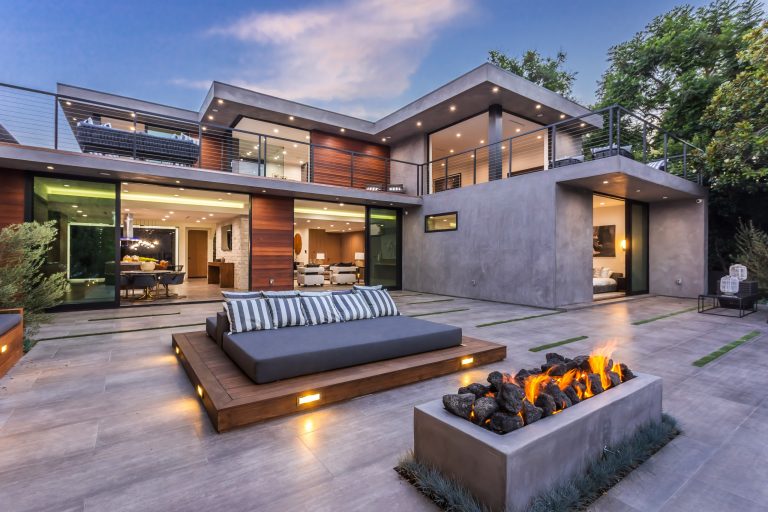 Inspiration for a large contemporary backyard tile patio remodel in Los Angeles with a fire pit and no cover