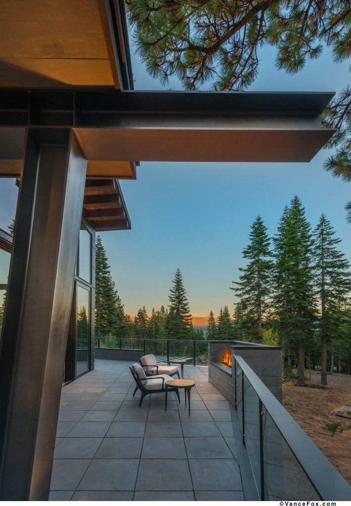Inspiration for a mid-sized contemporary backyard concrete patio remodel in Sacramento with a fire pit and a roof extension
