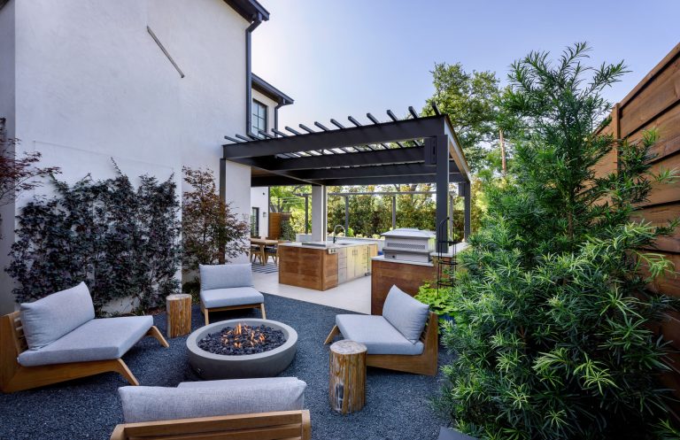 Mid-sized trendy backyard patio photo in Dallas with a fire pit and a pergola