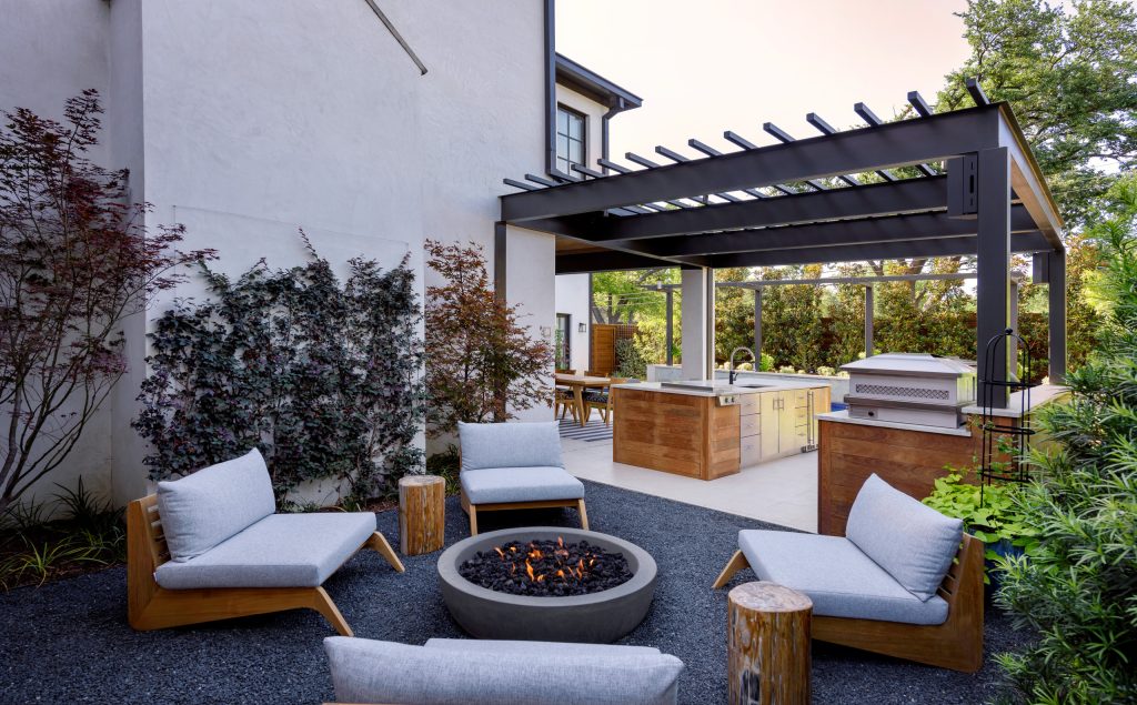 Example of a mid-sized trendy backyard patio design in Dallas with a fire pit and a roof extension