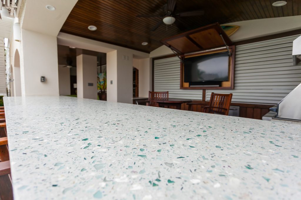 Manufacturer of custom recycled glass counter tops and landscape glass aggregate. The countertops are individually handcrafted and customized, using 100% recycled glass and diverting tons of glass from our landfills. The epoxy used is Low VOC (volatile organic compounds) and emits no off gassing. The newest product base is a high density, UV protected concrete. We now have indoor and outdoor options. As with the resin, the concrete offer the same creative aspects through glass choices.

Recycled glass used we Bombay liquor bottles, Coke bottle green, oyster shells and "urban" glass w/ mirror by GlassEco Surfaces by Fisher Recycling | Pool design | Pool Contracting | Swimming Pool Ideas | Swimming Pool Design Ideas