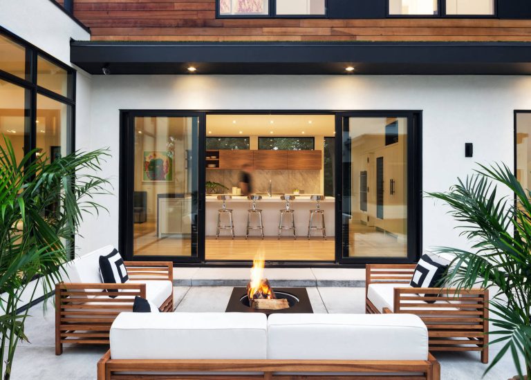 Patio - large contemporary concrete patio idea in Minneapolis with no cover and a fire pit