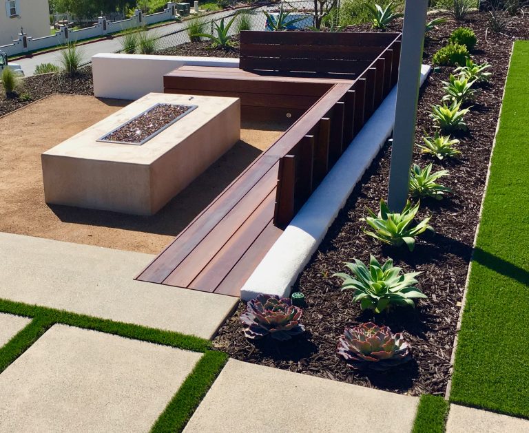 Inspiration for a mid-sized modern drought-tolerant and full sun backyard concrete paver landscaping in San Diego with a fire pit.