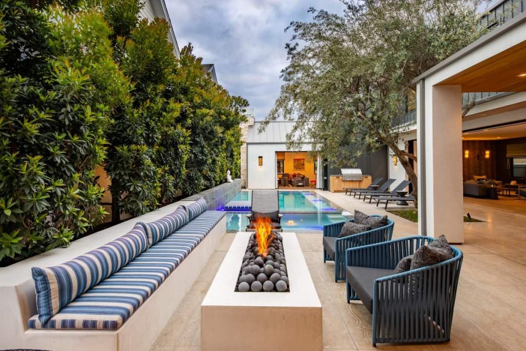 Patio - contemporary patio idea in Orange County with a fire pit and no cover