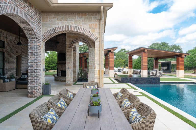 An expansive patio remodel turned modern and unique. With separate sitting areas for lounging, dining, and entertainment, this space will host any party this client may ever need!