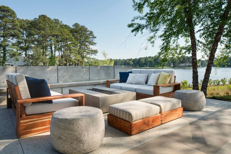 Inspiration for a large modern backyard concrete patio remodel in Other with a fire pit