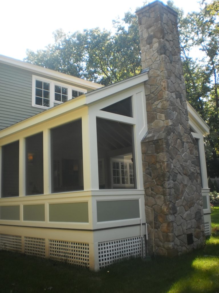 new screened porch with exterior fireplace
