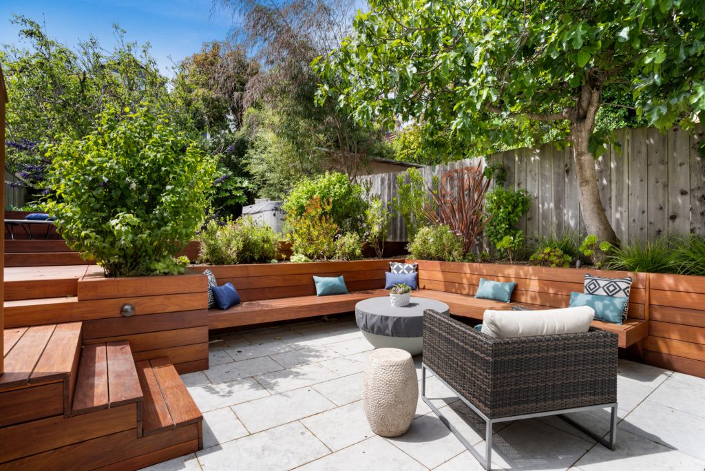 Example of a trendy patio design in San Francisco with a fire pit and no cover