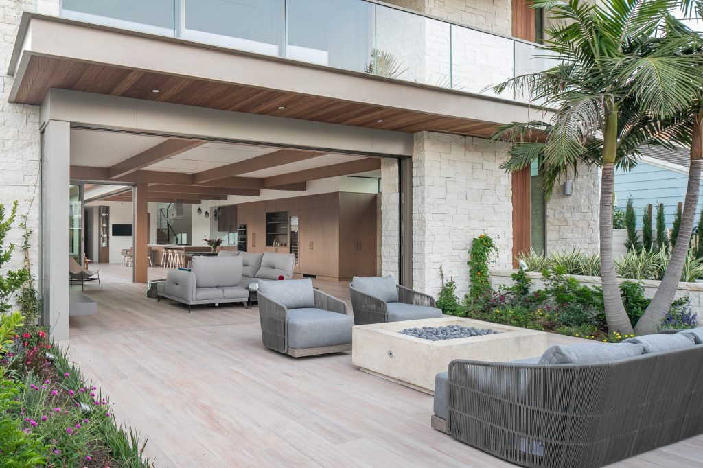 Inspiration for a contemporary tile patio remodel in Orange County with a fire pit and no cover