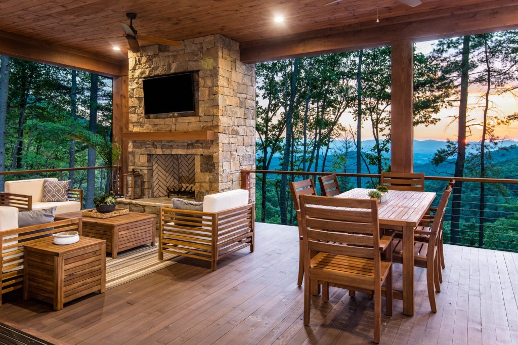 Example of a mountain style deck design in Other with a fire pit