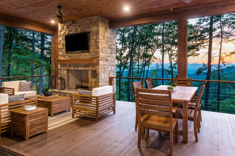 Example of a mountain style deck design in Other with a fire pit