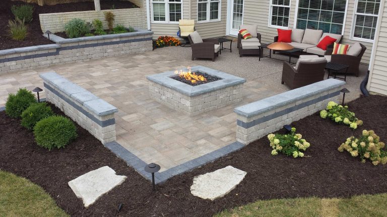 Inspiration for a mid-sized transitional backyard concrete paver patio remodel in Other with a fire pit and no cover