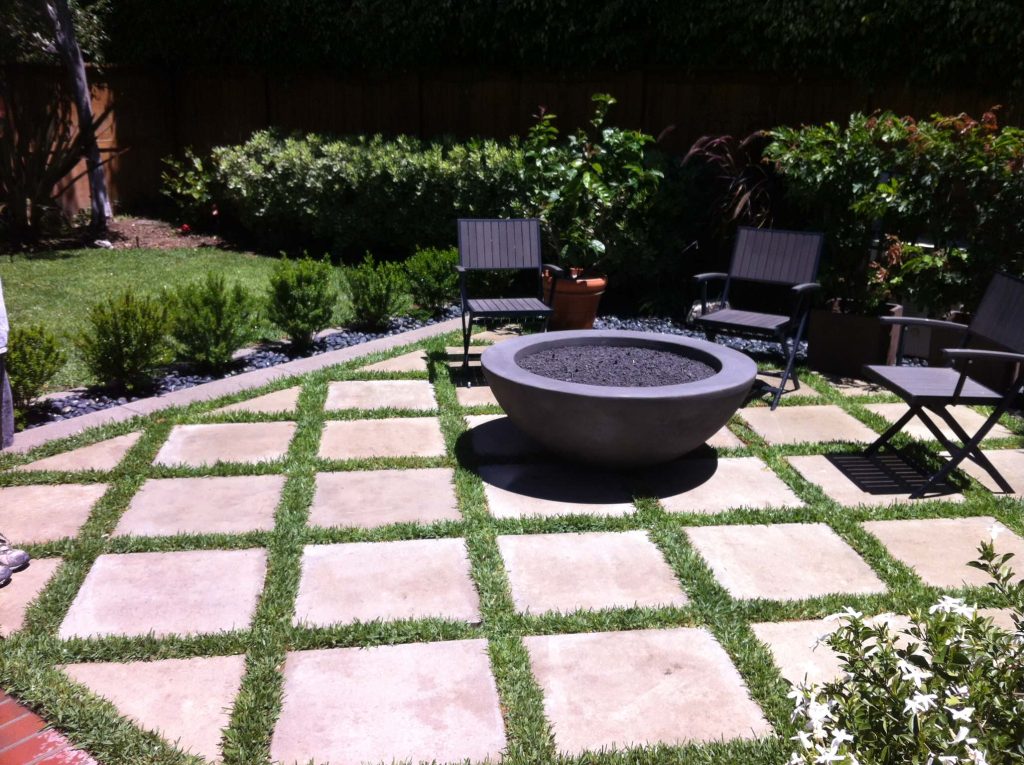 We created a custom paver design and included a gas fire pit.