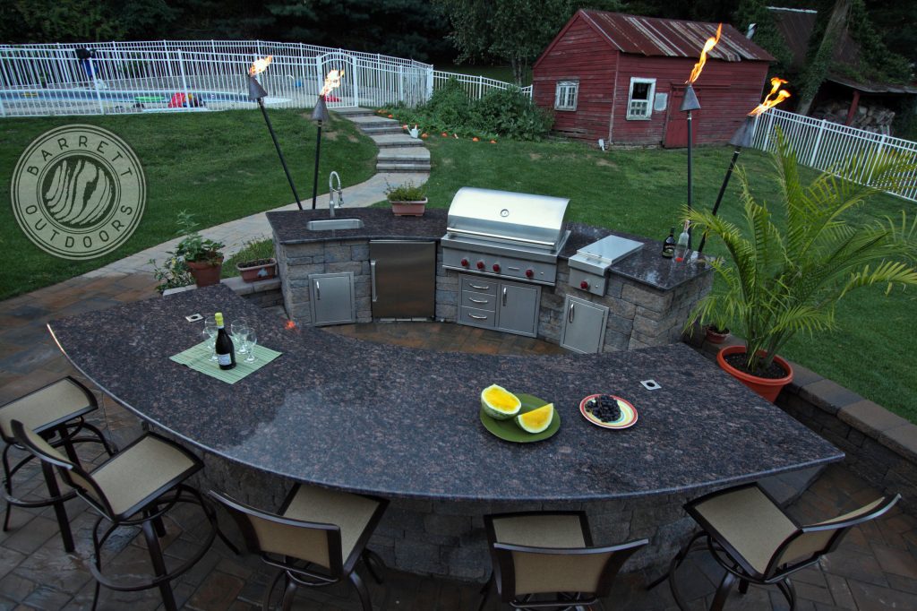 outdoor kitchen set near pool are easy to see whats going on in you backyard space.