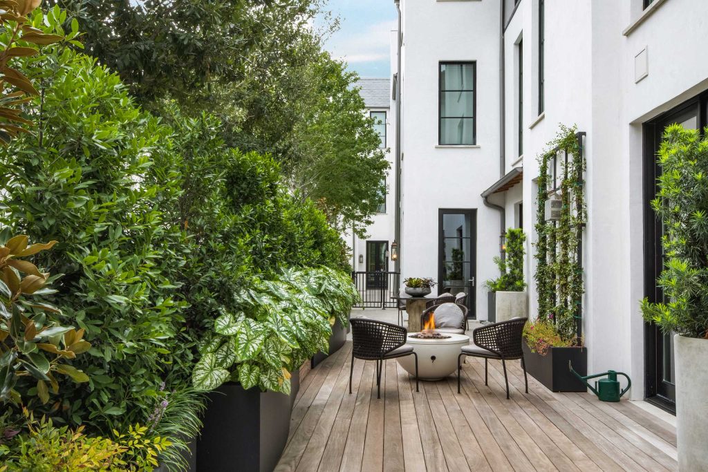 Example of a trendy deck design in Dallas with a fire pit and no cover