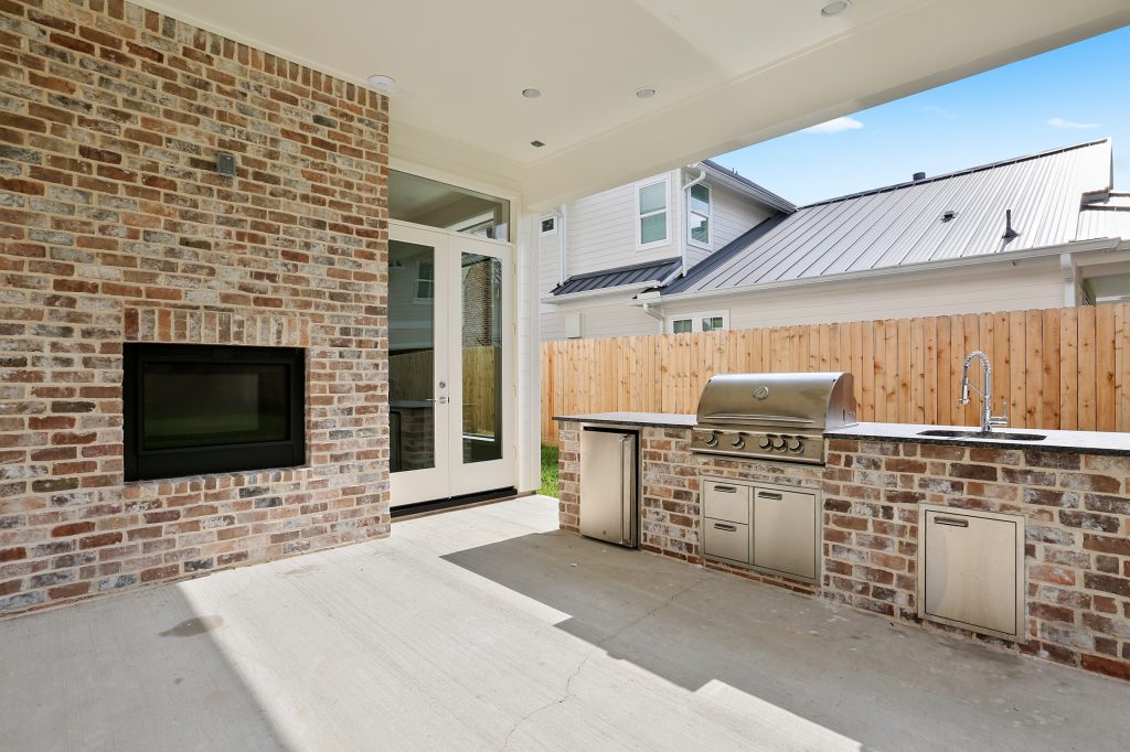 outdoor living with 2-way inside/outside fireplace.