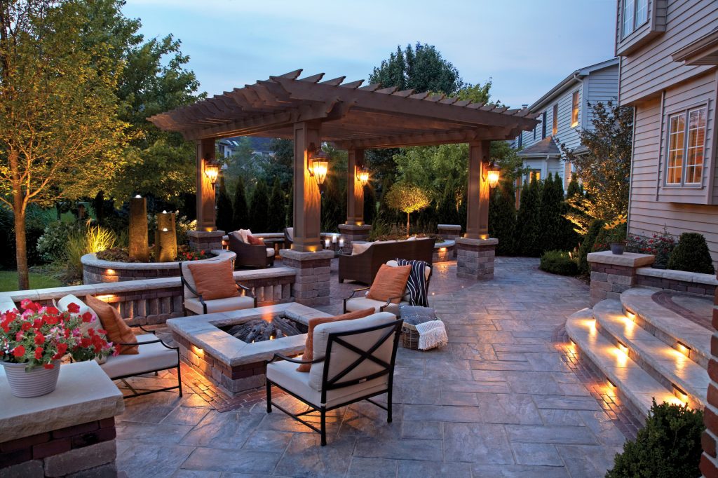 Inspiration for a large contemporary backyard patio remodel with a fire pit and a pergola