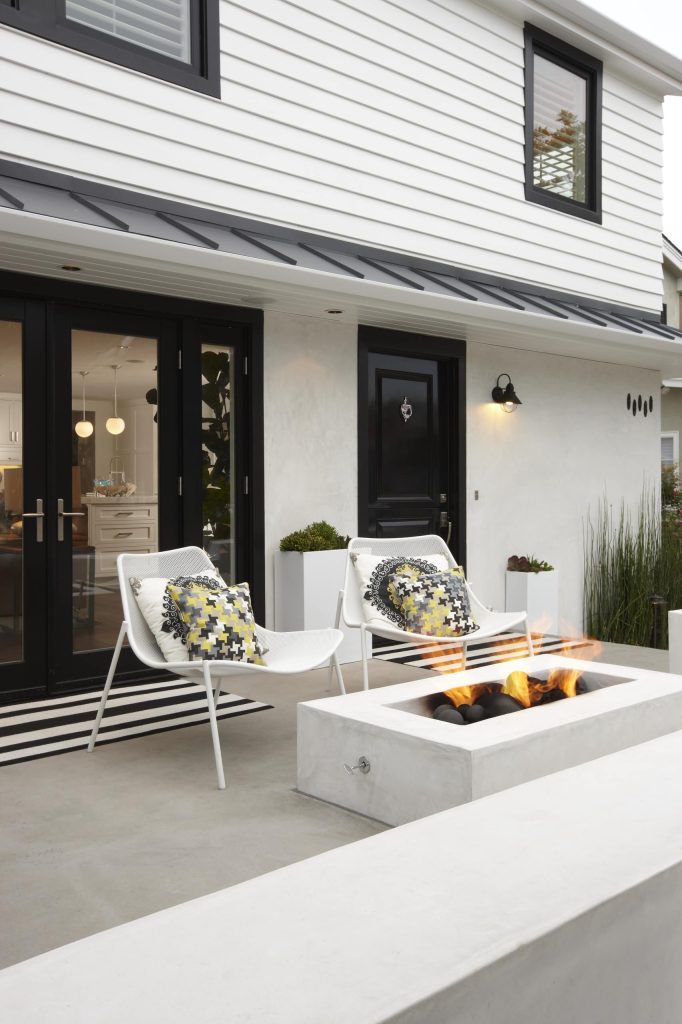 Inspiration for a transitional patio remodel in Orange County with a fire pit