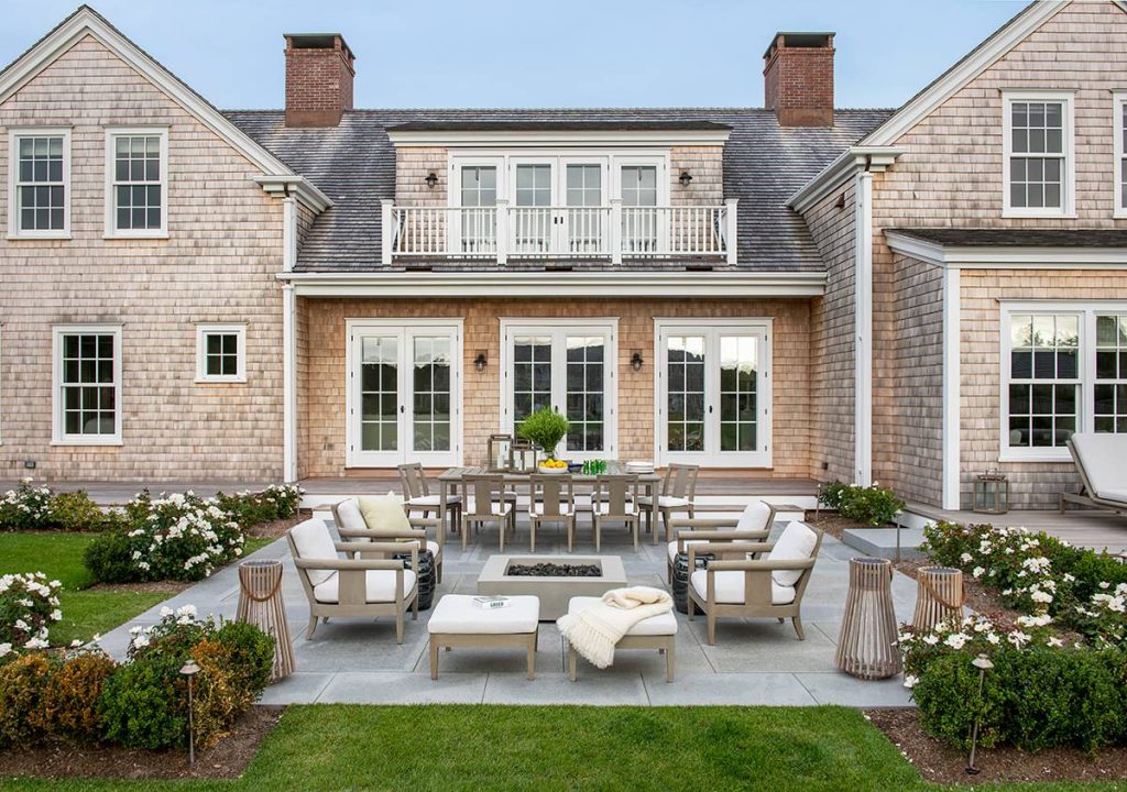 Inspiration for a coastal patio remodel in Providence with a fire pit and no cover