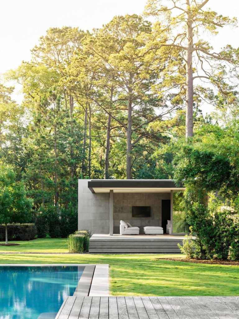 The separate guest/pool house has its own deck and secluded garden.

©Matthew MillmanInspiration for a contemporary rectangular lap pool house remodel in Houston with decking by Ehrlich Yanai Rhee Chaney Architects | Pool design | Pool Contracting | Swimming Pool Ideas | Swimming Pool Design Ideas