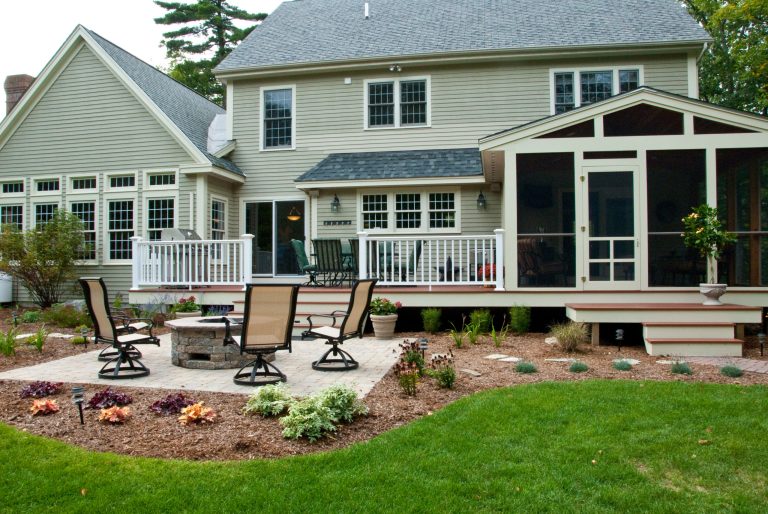 Mid-sized elegant backyard deck photo in Manchester with a fire pit and no cover