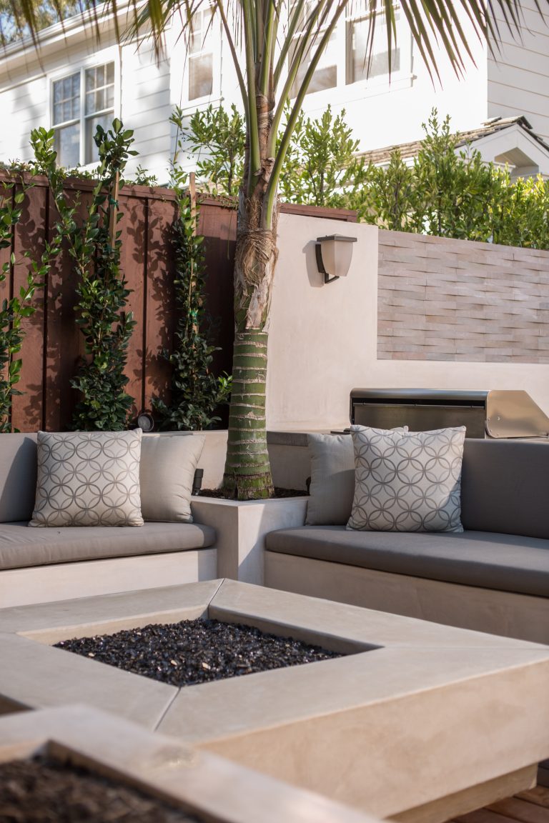 Patio - large modern backyard concrete patio idea in Orange County with a fire pit and no cover