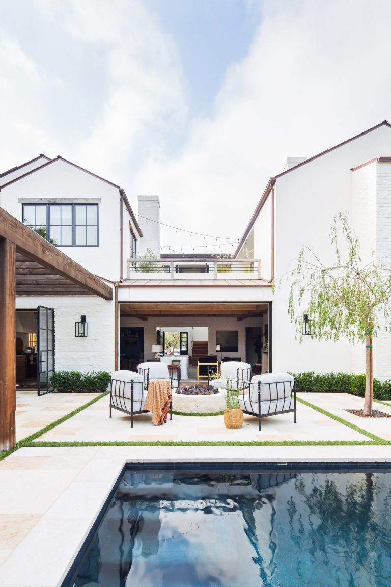 Transitional backyard patio photo in Los Angeles with a fire pit and no cover
