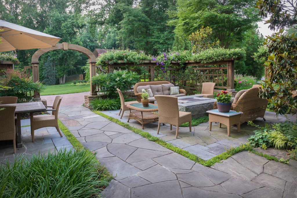 The front yard's entertaining and dining spaces, including a beautiful granite fire pit, are screened from the street by freestanding stone walls topped with custom-designed open-panel latitice work

Designed by H. Paul Davis Landscape Architects.

.©Melissa Clark Photography. All rights reserved. by Landscape Projects, Inc. | Fire Pits|Backyard Design|Outdoor Living Spaces|Landscape Design|Backyard Ideas|Landscaping|Landscaping Ideas|Landscape Installation|Fire Feautures|Fire Pit