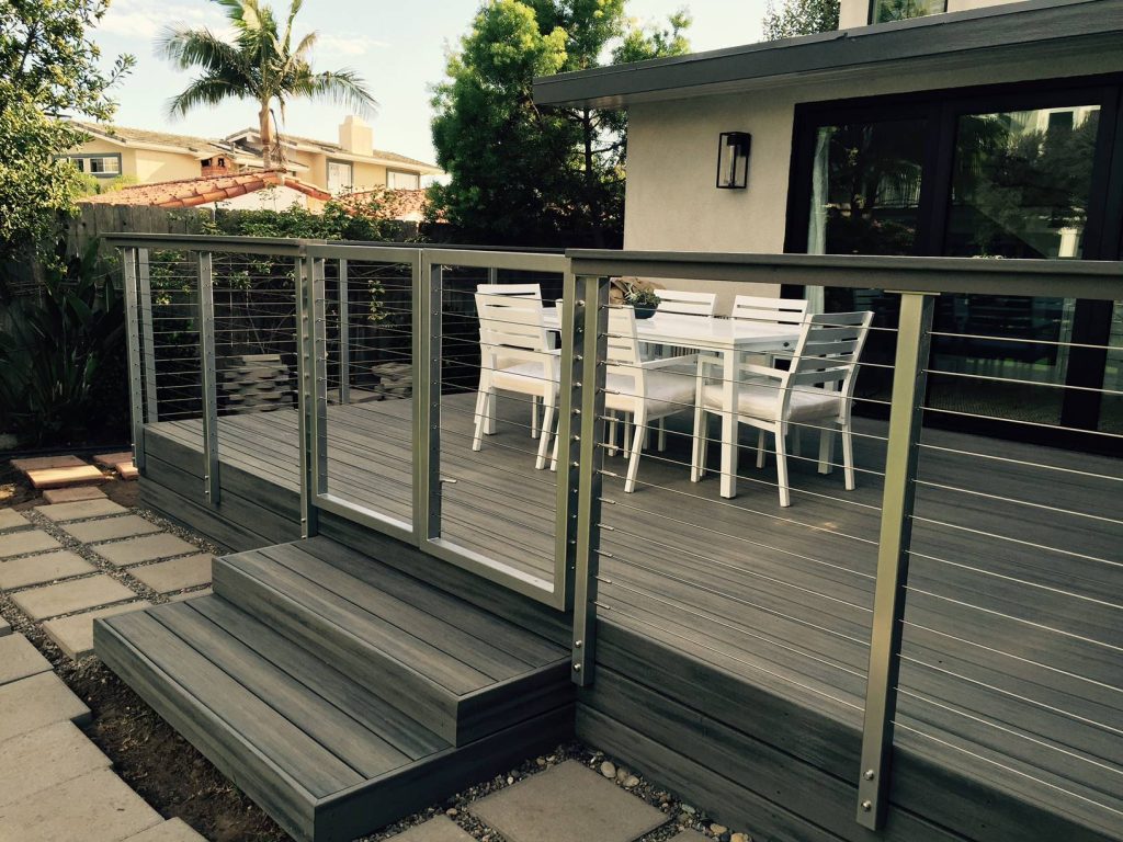 powder coated stainless steel post with a 2x4 cedar top rail and a 1x6 trex cap