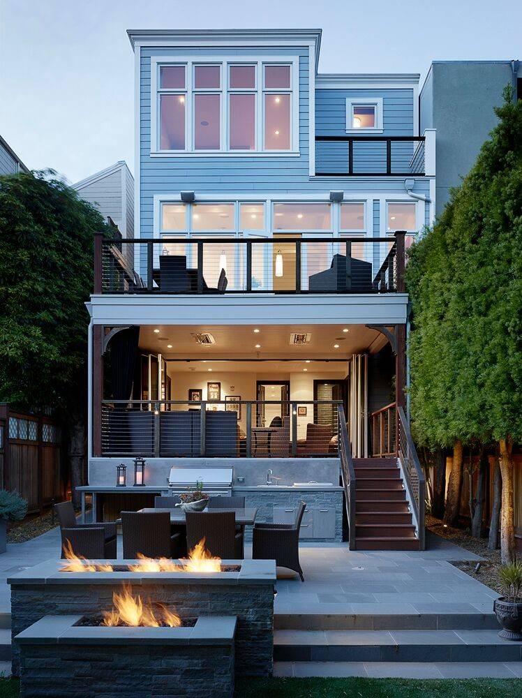 Inspiration for a mid-sized transitional backyard stone patio remodel in San Francisco with a fire pit and no cover