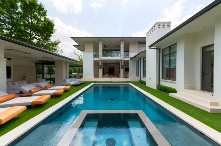 rear yard with pool and cabana