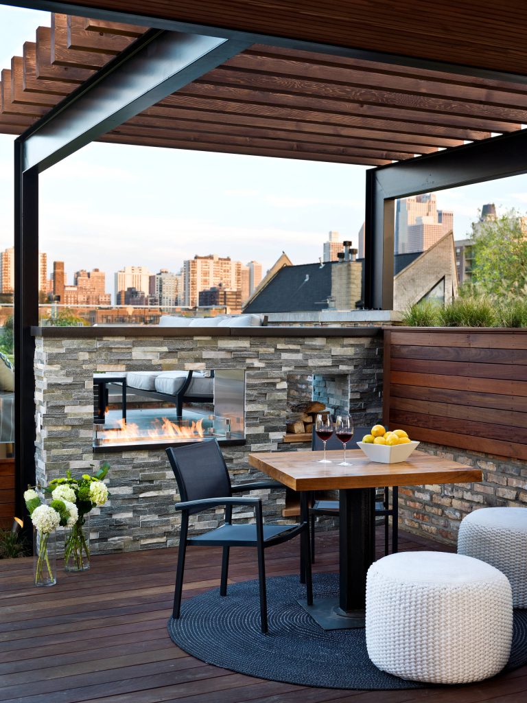 The custom double sided fireplace helps to frame the Chicago skyline. Cynthia Lynn