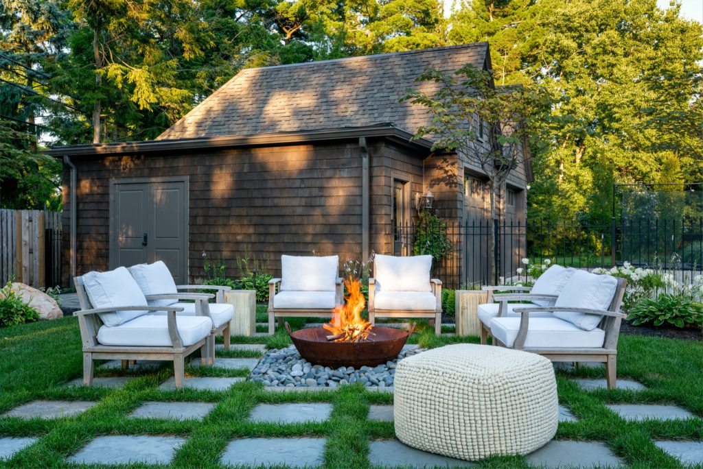 Inspiration for a timeless patio remodel in Columbus with a fire pit and no cover