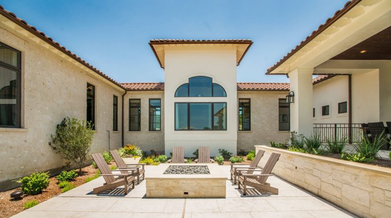 Tuscan courtyard patio photo in Austin with a fire pit and no cover