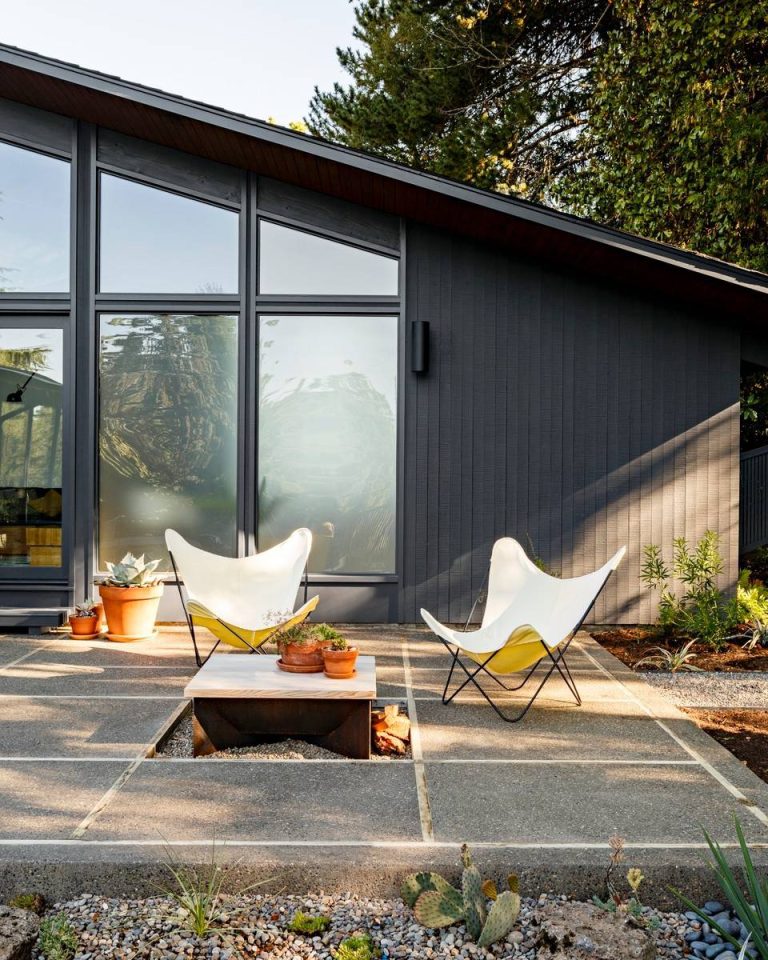 Example of a 1960s patio design in Portland with a fire pit and no cover