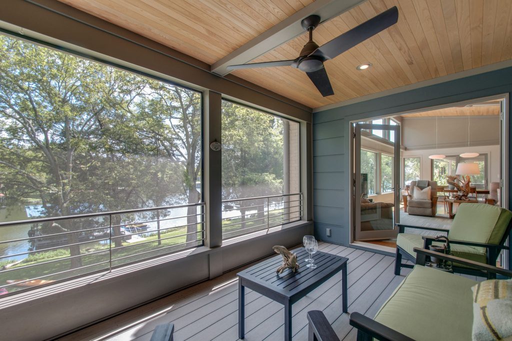 screened in porch overlooking lake with wood ceiling and trex flooring