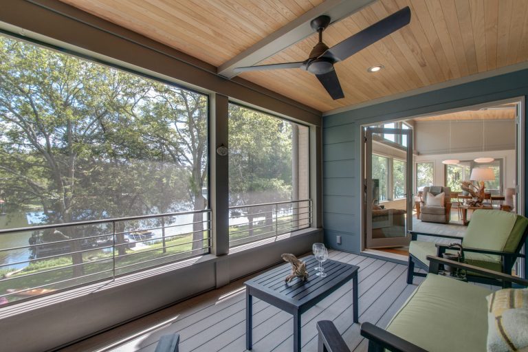 screened in porch overlooking lake with wood ceiling and trex flooring