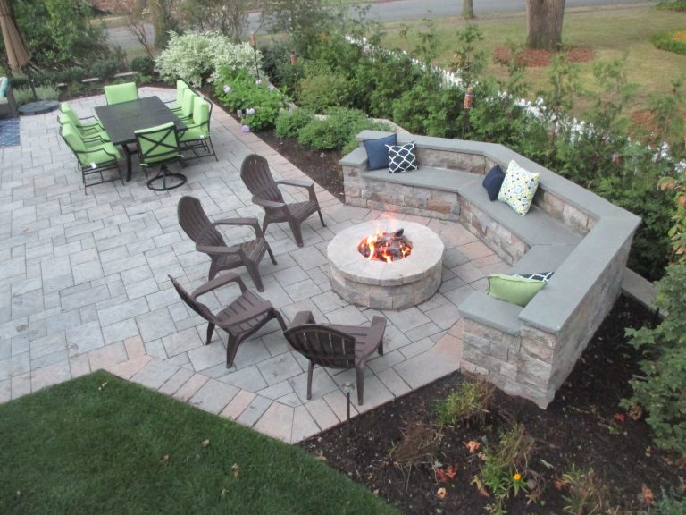 Patio - large traditional backyard tile patio idea in New York with a fire pit and no cover