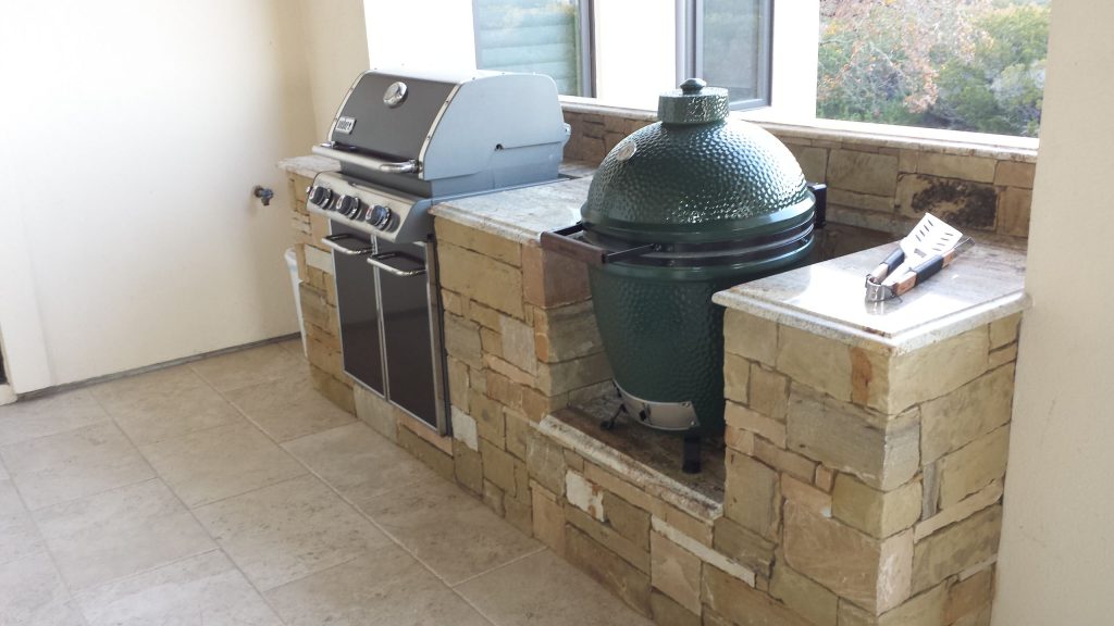 Second grilling area. Granite Counter tops, Big Green Egg, built in Weber Grill. Sandstone structure
